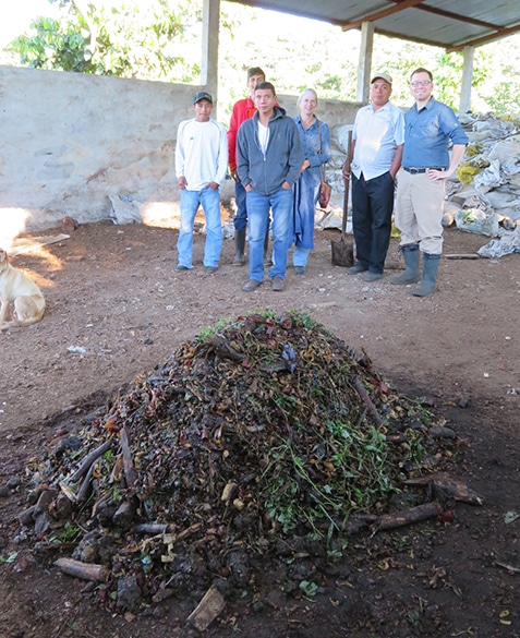 Purposefully built compost and the farm staff at La Esperanza in Guatemala. January 2017.