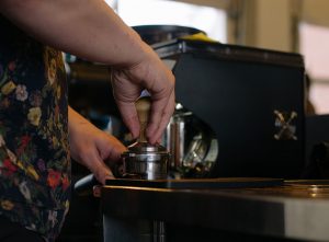 Alex Werth prepares a shot of espresso at Blueprint Coffee Watson.