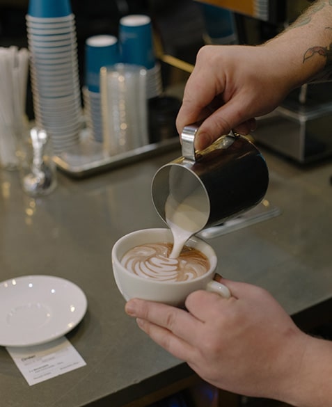 ryan stakes pours a mocha latte at blueprint coffee delmar