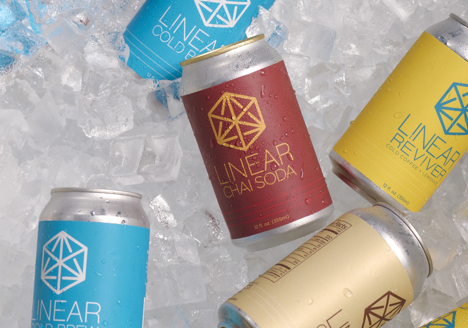 Cans of Linear craft beverages in a cooler of ice
