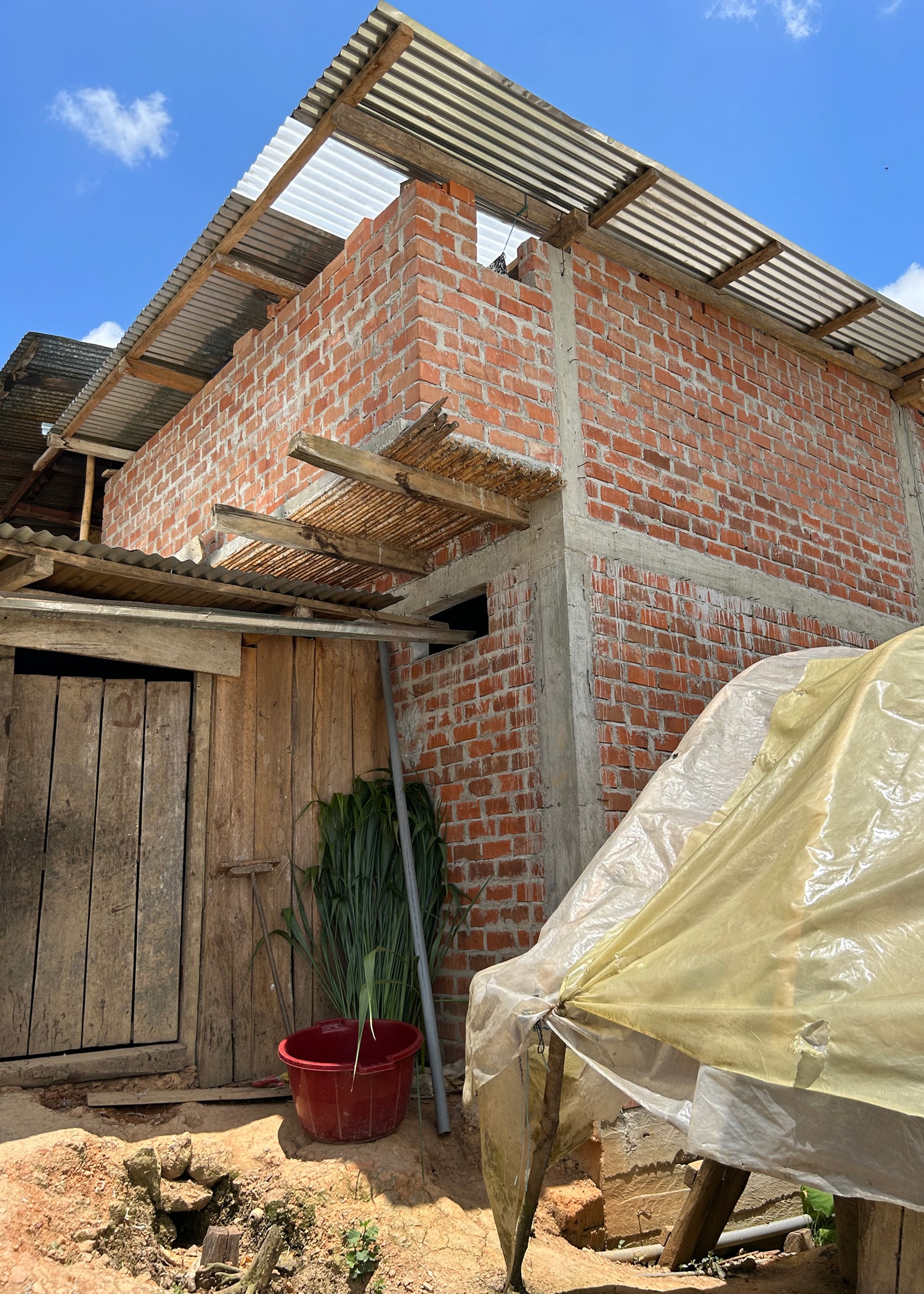 A kitchen addition being built onto a farmers existing home.