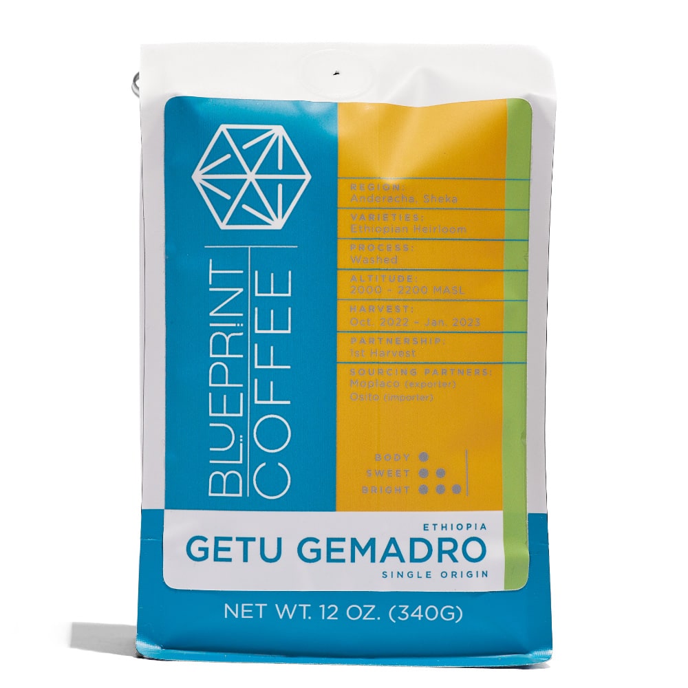A 12-ounce bag of Getu Gemadro coffee beans featuring the Blueprint Coffee logo and detailed information about the coffee's attributes.
