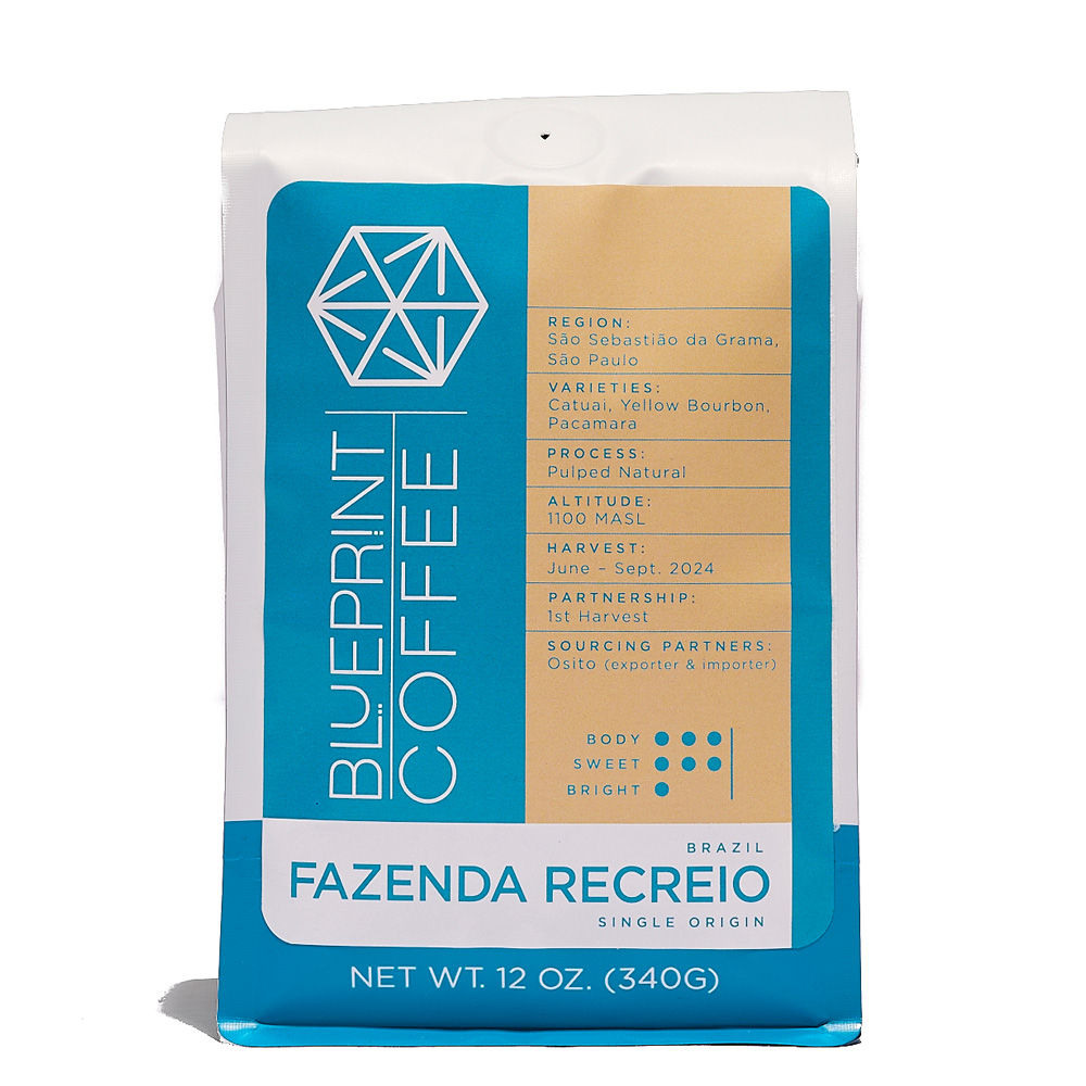 A 12-ounce bag of coffee beans bearing the Blueprint Coffee logo in blue on the left and information about the coffee on the right. The bag is titled Fazenda Recreio.