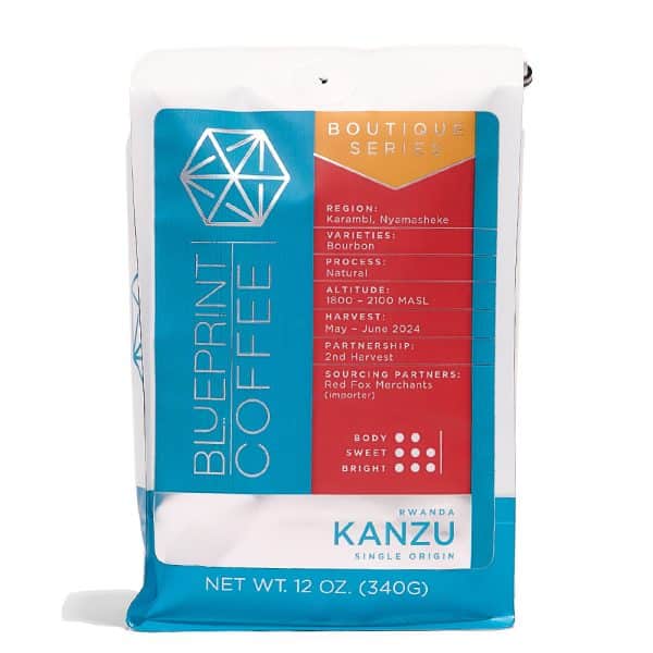 A 12-ounce bag of Kanzu, Rwanda coffee beans. It features the Blueprint Coffee logo in blue on the left side with coffee details on the right in red.