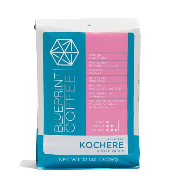 A 12-ounce bag of Kochere, Ethiopia coffee beans. It features the Blueprint Coffee logo on the left half and coffee details in pink on the right half.