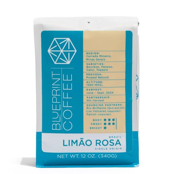 A 12-ounce bag of Limão Rosa, Brazil coffee beans. The Blueprint Coffee logo is on the left half, and details about the coffee sourcing and location is on the right with a cream background.