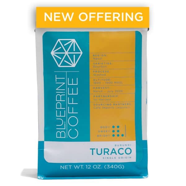 A 12-ounce bag of Turaco, Burundi coffee beans. It features the Blueprint Coffee logo on the left half and coffee details in yellow on the right half.