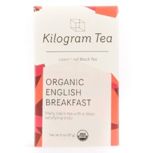 A box of Kilogram Tea's English Breakfast. It bears the Kilogram logo, tea and tea information on the label. Red accents are featured on the grey box.