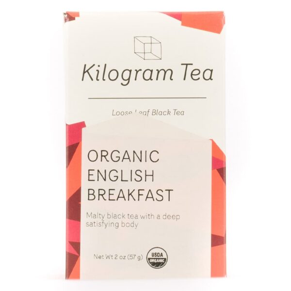 A box of Kilogram Tea's English Breakfast. It bears the Kilogram logo, tea and tea information on the label. Red accents are featured on the grey box.