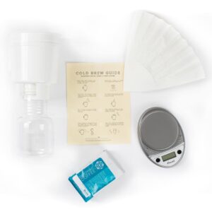 Photo of Cold Brew kit, containing a Toddy brewing system, a scale, a coffee filter, a brewing guide, and a bag of linear.