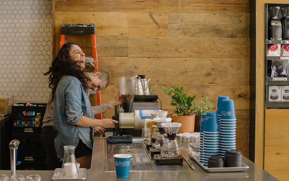 Ashley enjoys a funny moment with coworker Nes Leeves.