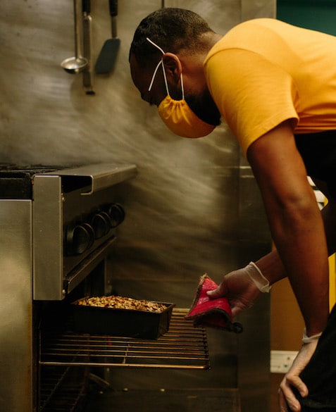 El Profile 7 El Strickland takes freshly baked banana bread out of the oven