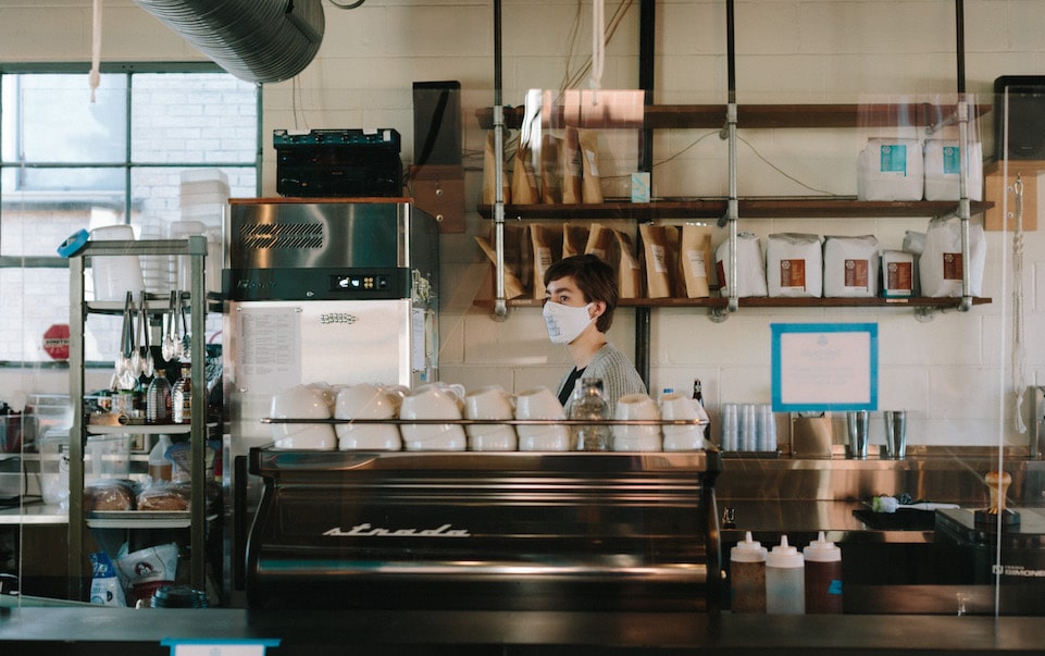 MG 7 MG Batts working behind the coffee bar at Blueprint Coffee Watson