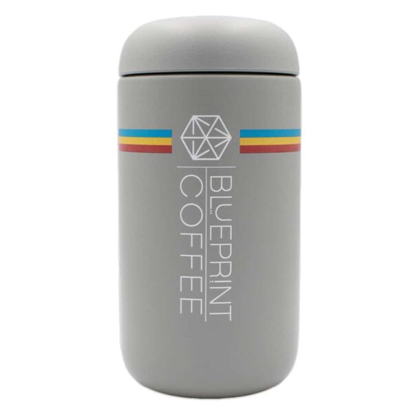 A 12-ounce grey insulated coffee tumbler with the blueprint branding.