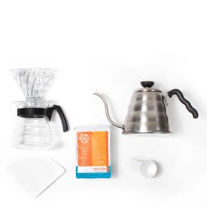 The items in a v60 brew kit. Dripper, carafe, bag of tekton, pouring kettle.