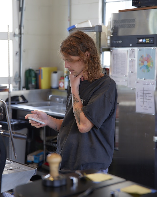 Ethan behind the bar at our Watson café