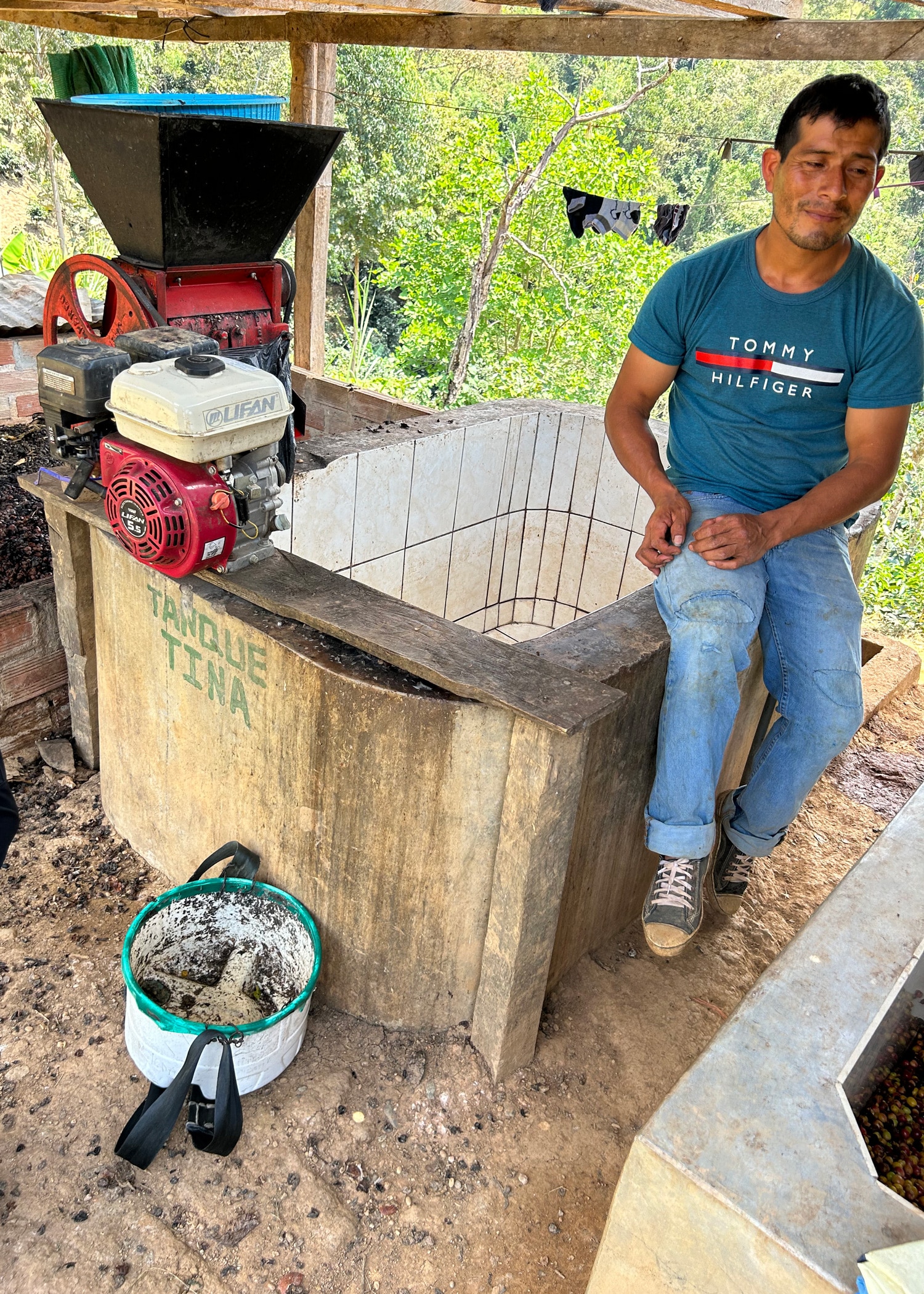 Johnny Sevada from San Ramon group talking about his processing. Cher Denny and companions sit in the back of a 4-wheeled truck for the trip up to some coffee farms in Cajamarca.