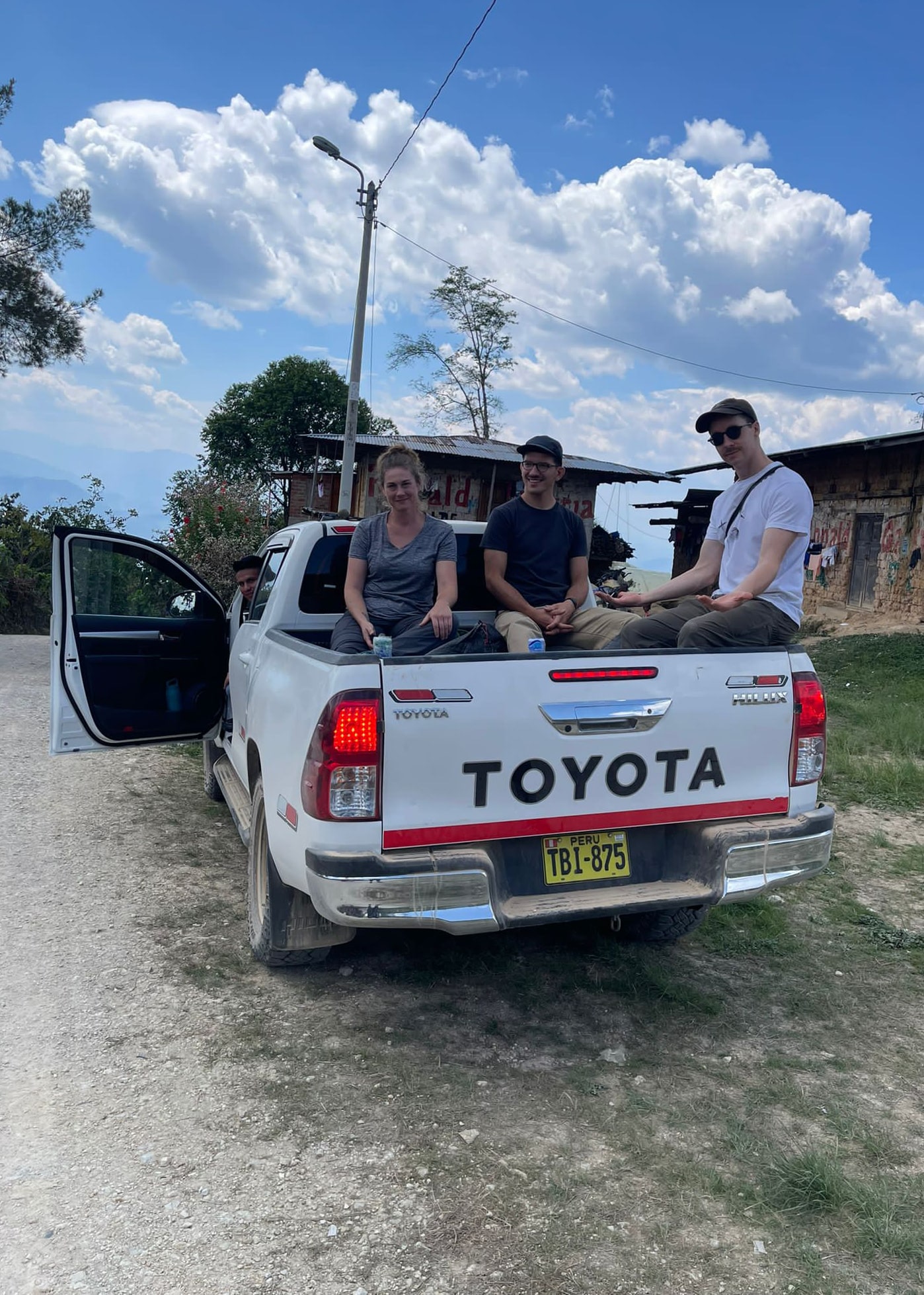 Getting to a farm is often an intense trek that often involves 4-wheel driving along ill-maintained paths followed with an additional hike of 30-60 minutes. Cher Denny and companions sit in the back of a 4-wheeled truck for the trip up to some coffee farms in Cajamarca.