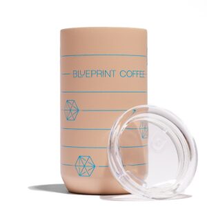 A 12-ounce sandy brown Blueprint Coffee "cube" tumbler against a white background. The tumbler is a sandy brown color with blue print. The lid rests against the side.