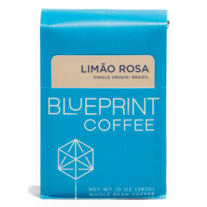 A blue 10-ounce bag of Limão Rosa coffee beans featuring the Blueprint Coffee Logo and a light tan removable info card.