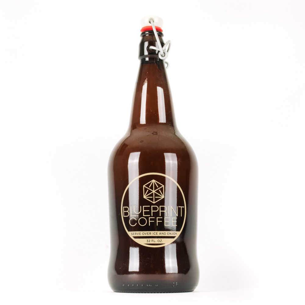A translucent brown bottle, or growler, featuring the Blueprint Coffee logo and a swinging sealable cap.