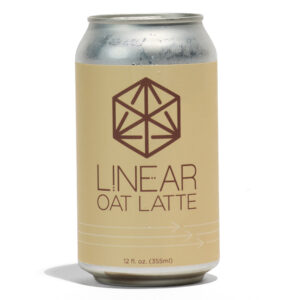 A cream-colored can of Linear Oat Latte featuring the Linear logo and text in brown.