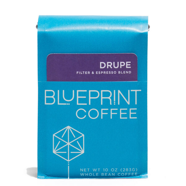 A blue 10-ounce bag of Drupe Filter & Espresso Blend coffee beans featuring the Blueprint Coffee Logo and a removable info card.