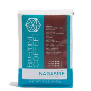A 12oz Bag of Nagasire, Uganda coffee beans. It features the Blueprint Coffee Logo in blue on the left side and coffee information in brown on the right side.