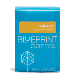 A blue 10-ounce bag of Turaco, Burundi coffee beans featuring the Blueprint Coffee Logo and a removable info card.