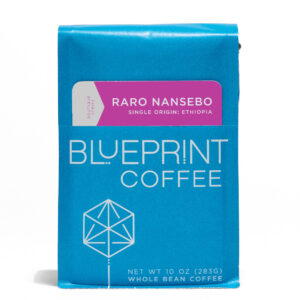 A 10-ounce bag of Raro Nansebo, Ethiopia coffee beans. The package is blue with the Blueprint Coffee Logo and the coffee name is in purple and grey.