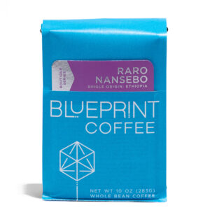 A 10-ounce bag of Raro Nansebo, Ethiopia coffee beans. The package is blue with the Blueprint Coffee Logo and the coffee name is in purple and grey.