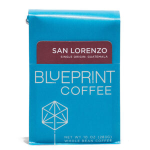 A blue 10-ounce bag of San Lorenzo, Guatemala coffee beans featuring the Blueprint Coffee Logo and a removable info card.