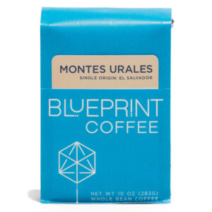 A 10-ounce bag of Montes Urales, El Salvador coffee beans. The photo shows a blue package bearing the Blueprint Coffee name and logo along with the coffee's name in cream and blue.