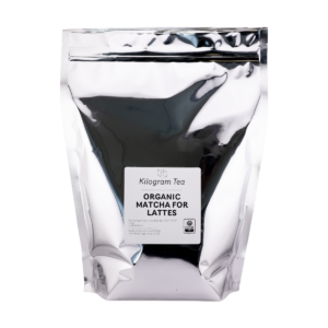 A large silver bag of Organic Matcha for Lattes featuring a white square label and text in the middle.