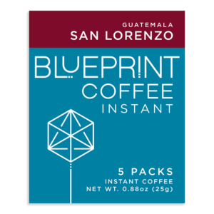 The label of a white box containing San Lorenzo, Guatemala instant coffee roasted by Blueprint Coffee. The box features the Blueprint Coffee logo in blue and the coffee name in red.